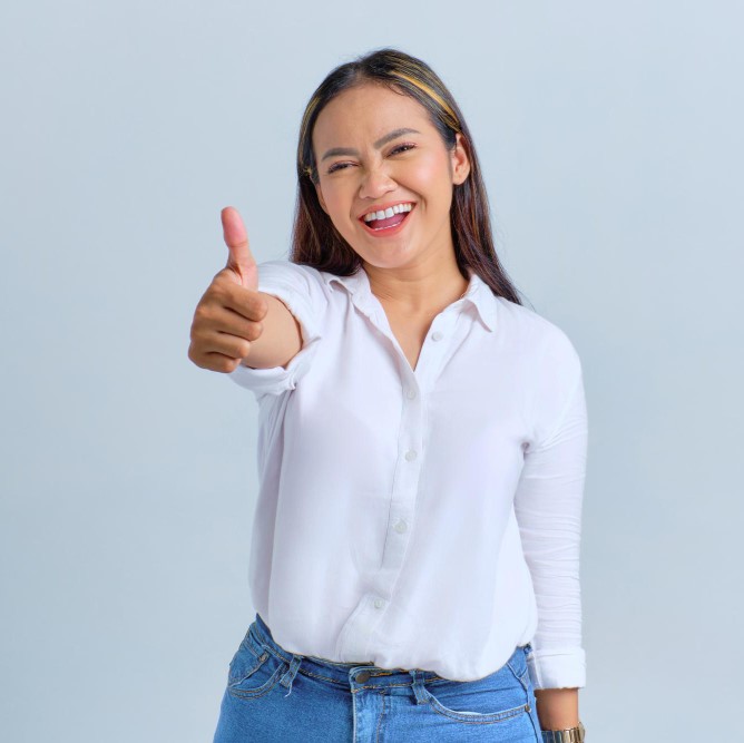 smiling-young-asian-woman-showing-thumb-up-gesture-recommending-something-good-isolated-white-background
